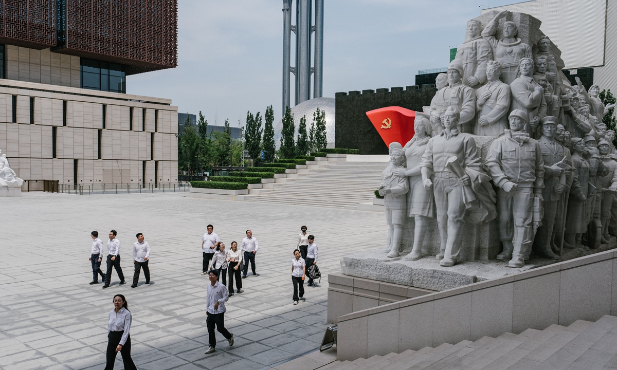 Visitors look at a large sculpture that tells the CPC's struggles for the well-being of the Chinese people and national rejuvenation in the Museum of the Communist Party of China's square in Beijing on June 18, 2024. Photo: Li Hao/GT