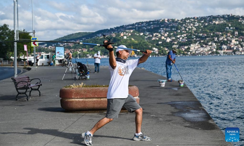 A man fishes by the Bosphorus Strait in Istanbul, Türkiye, June 25, 2024. (Photo: Xinhua)