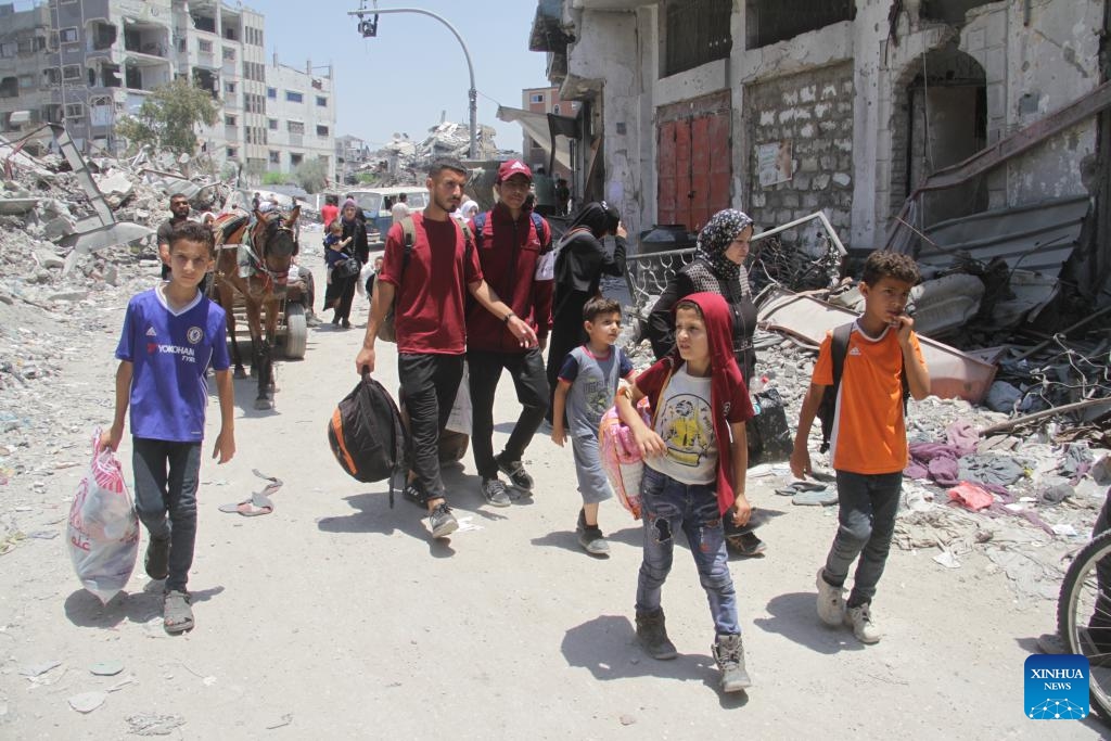 People leave their home in the neighborhood of Shuja'iya in the east of Gaza City, on June 27, 2024. The Israeli army on Thursday ordered residents of neighborhoods in eastern Gaza City to evacuate immediately amid the incursion of its military forces into the areas. (Photo: Xinhua)