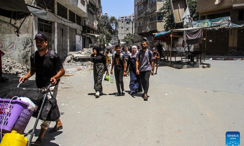 People leave their home in the neighborhood of Shuja'iya in the east of Gaza City, on June 27, 2024. The Israeli army on Thursday ordered residents of neighborhoods in eastern Gaza City to evacuate immediately amid the incursion of its military forces into the areas.(Photo: Xinhua)