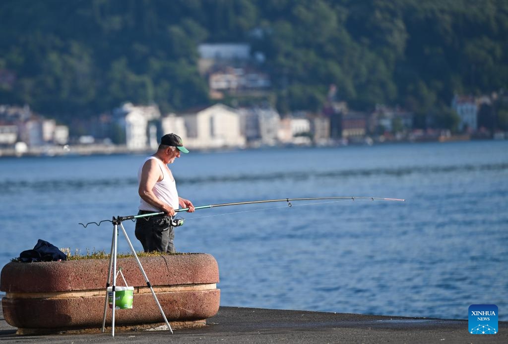 A man fishes by the Bosphorus Strait in Istanbul, Türkiye, June 25, 2024. (Photo: Xinhua)