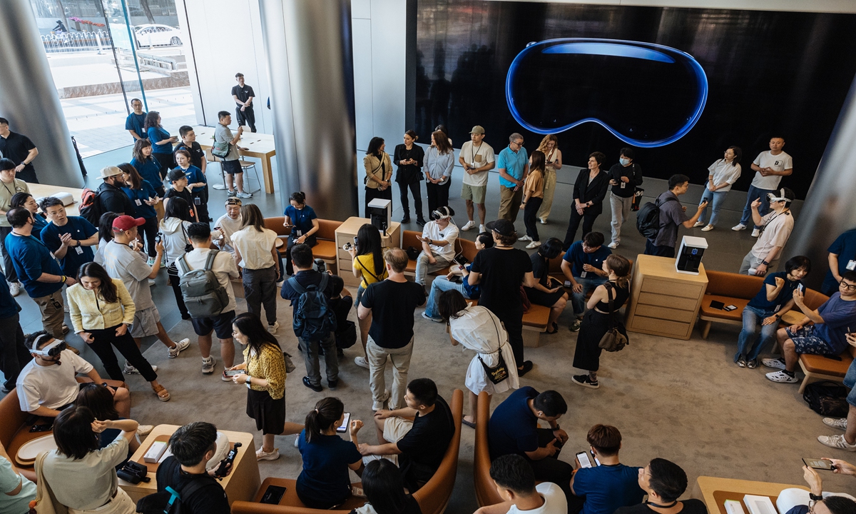 Customers try out the Apple Vision Pro at an Apple Store on Wangfujing Street in Beijing, as the product officially goes on sale on June 28, 2024 in China. Photo: Li Hao/GT