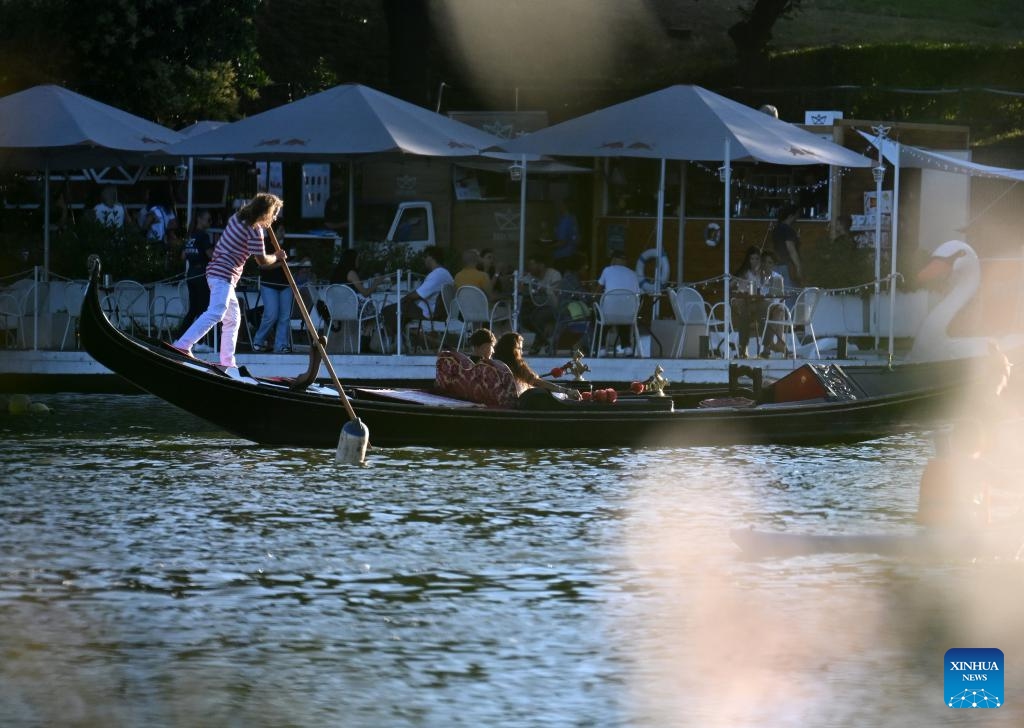 Tourists sail on a gondola, a typical traditional rowing boat of Venice, in Rome, Italy, June 26, 2024. (Photo: Xinhua)