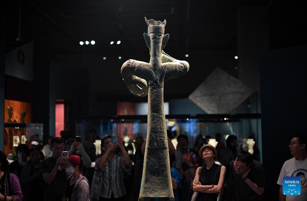 Visitors view a bronze replica exhibit during an exhibition named Unveiling Sanxingdui and Jinsha of Ancient Shu Civilization at the Grand Canal Museum of Beijing, in Beijing, capital of China, June 27, 2024. With a total of 265 pieces of relics featuring ancient Shu civilization, the exhibition kicked off here on Thursday and will last until Oct. 10. (Photo: Xinhua)