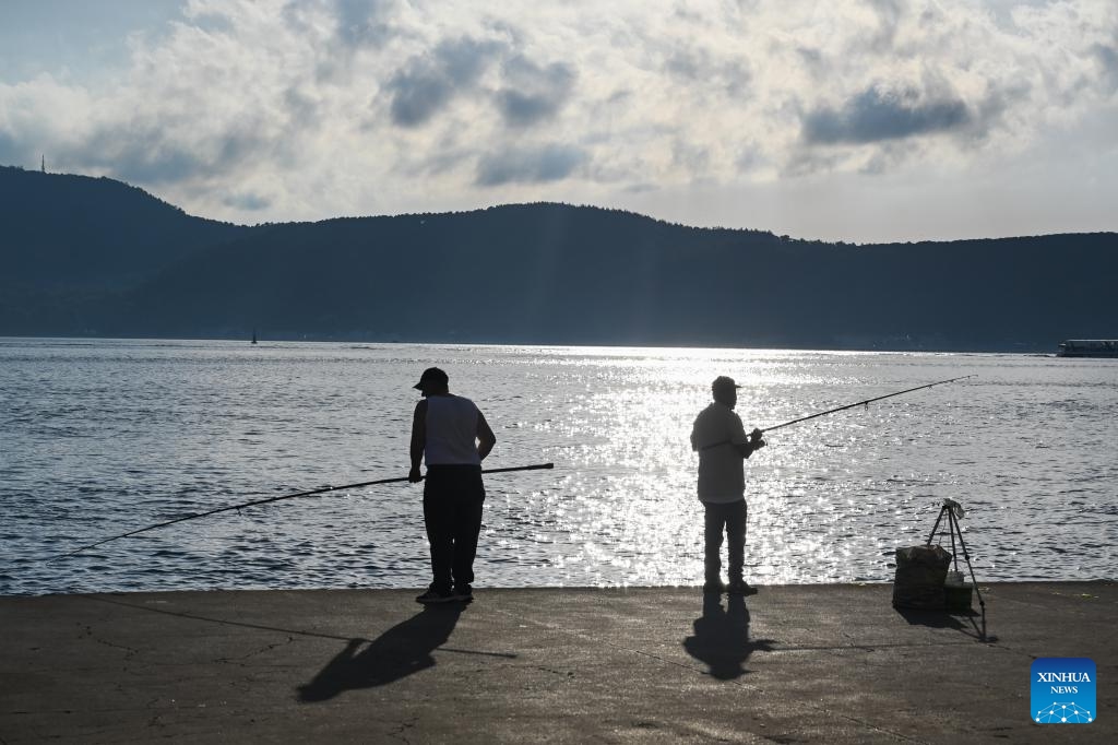 People fish by the Bosphorus Strait in Istanbul, Türkiye, June 25, 2024. (Photo: Xinhua)