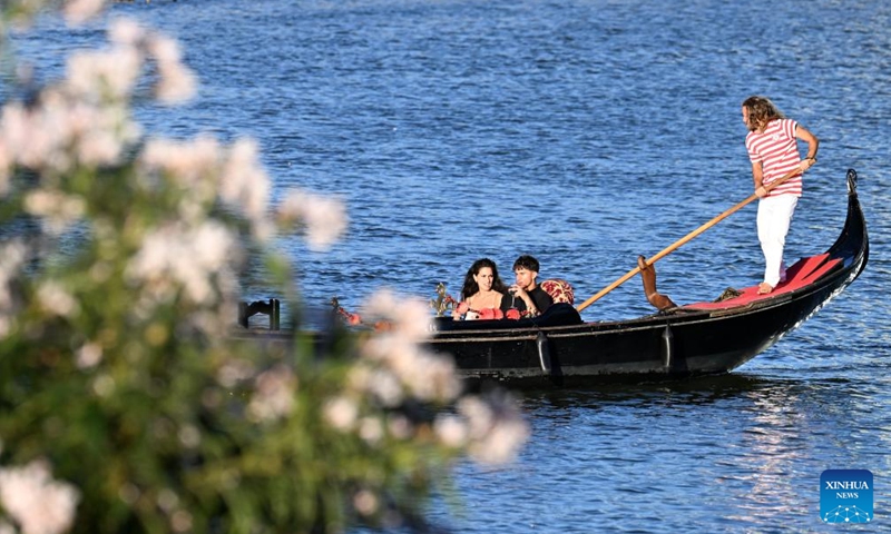 Tourists sail on a gondola, a typical traditional rowing boat of Venice, in Rome, Italy, June 26, 2024. (Photo: Xinhua)