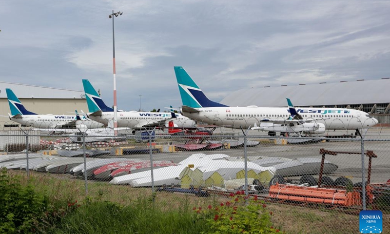 WestJet Boeing 737-800 aircraft are seen parking at Vancouver International Airport in Richmond, British Columbia, Canada, June 29, 2024. Canada's second largest airline, the WestJet Group, said Friday it is outraged at an unexpected strike by its aircraft maintenance engineers.