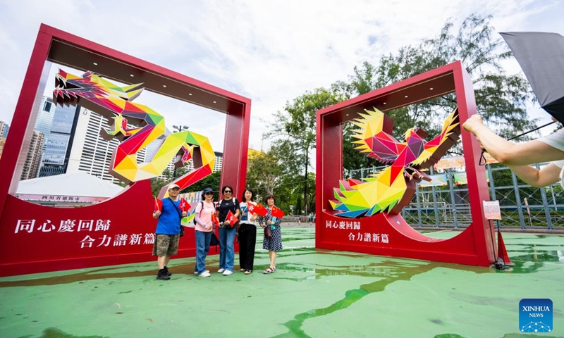 People pose for photos at a celebration activity marking the 27th anniversary of Hong Kong's return to the motherland in Victoria Park in Hong Kong, south China, June 29, 2024. (Xinhua/Zhu Wei)