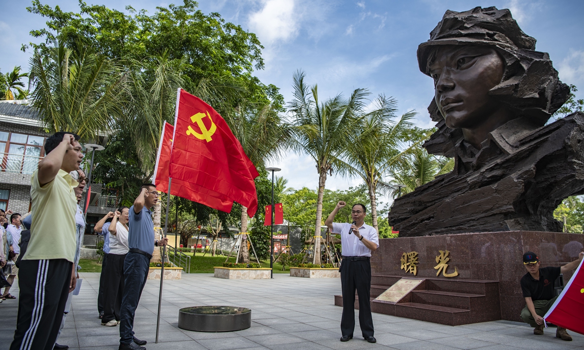 A group of the Communist Party of China (CPC) members review the Party oath at the Red Detachment of Women Memorial Park in Qionghai, South China's Hainan Province, on June 30, 2024, a day before the CPC celebrates its 103rd founding anniversary on July 1. Photo: VCG