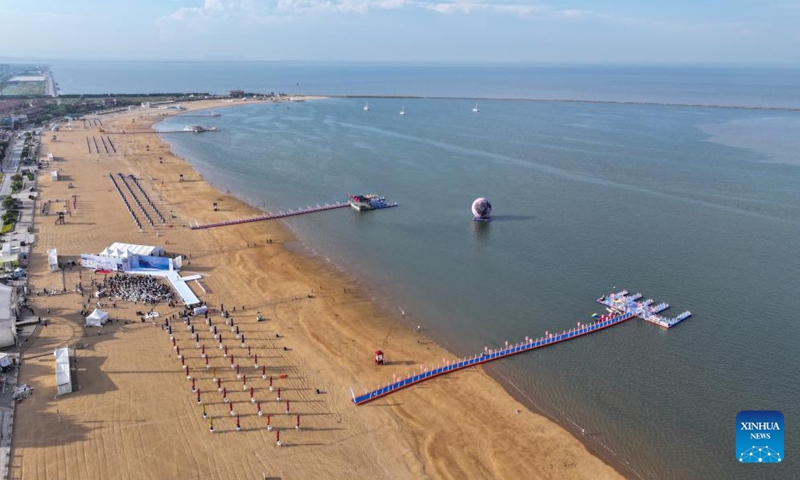 This aerial drone photo taken on June 14, 2024 shows a view of the Dongjiangwan scenic area in the Binhai New Area of north China's Tianjin. Over the years, the city of Tianjin has worked on the ecological restoration and development of Bohai Sea.