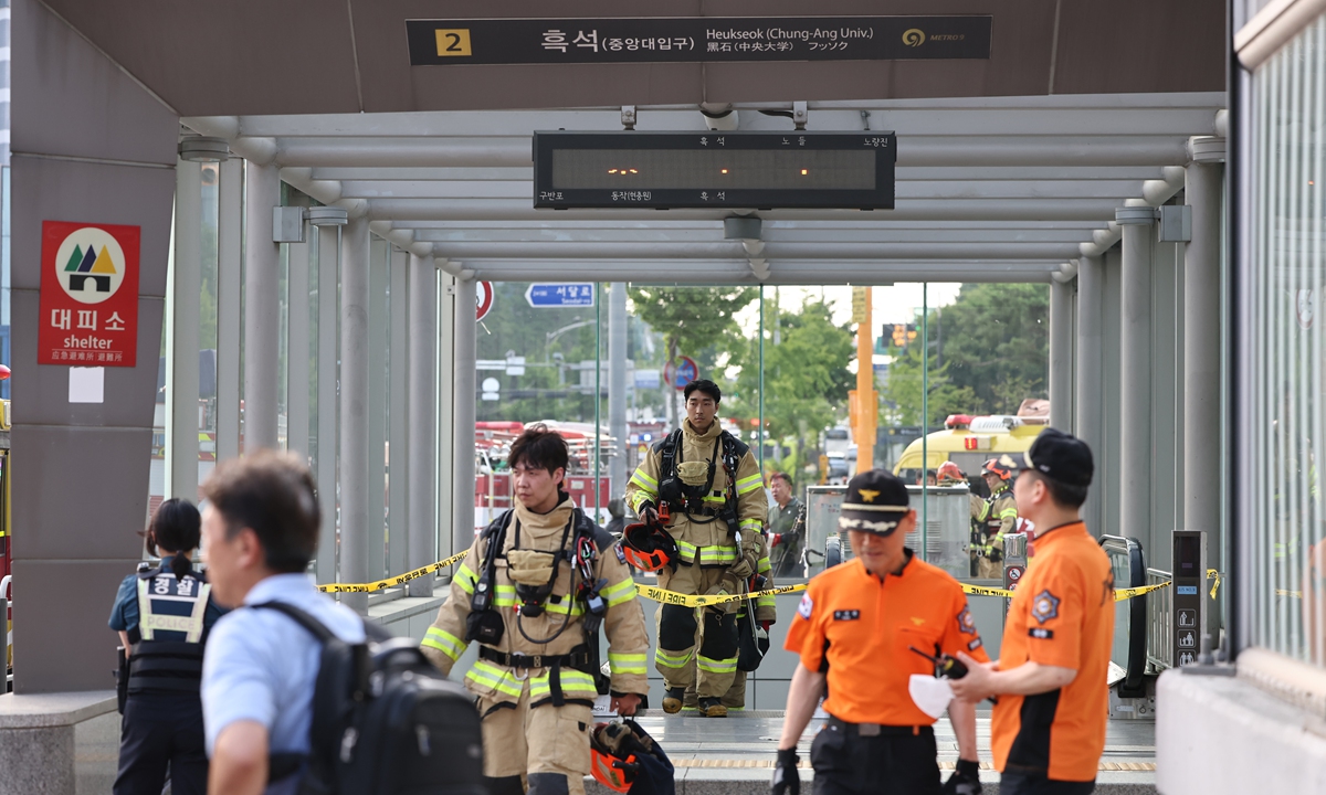 Firefighters walk out of Seoul Subway Line 9's Heukseok Station on July 1, 2024 in Seoul, South Korea, after smoke from an unknown source was seen at the station at around 4:42 pm on this day. The train was asked to pass through the station without stopping. Officials say investigations are ongoing. Meanwhile, Dogok-Daechi Station on Line 3 was suspended due to smoke around dawn that day. 

Photo: VCG