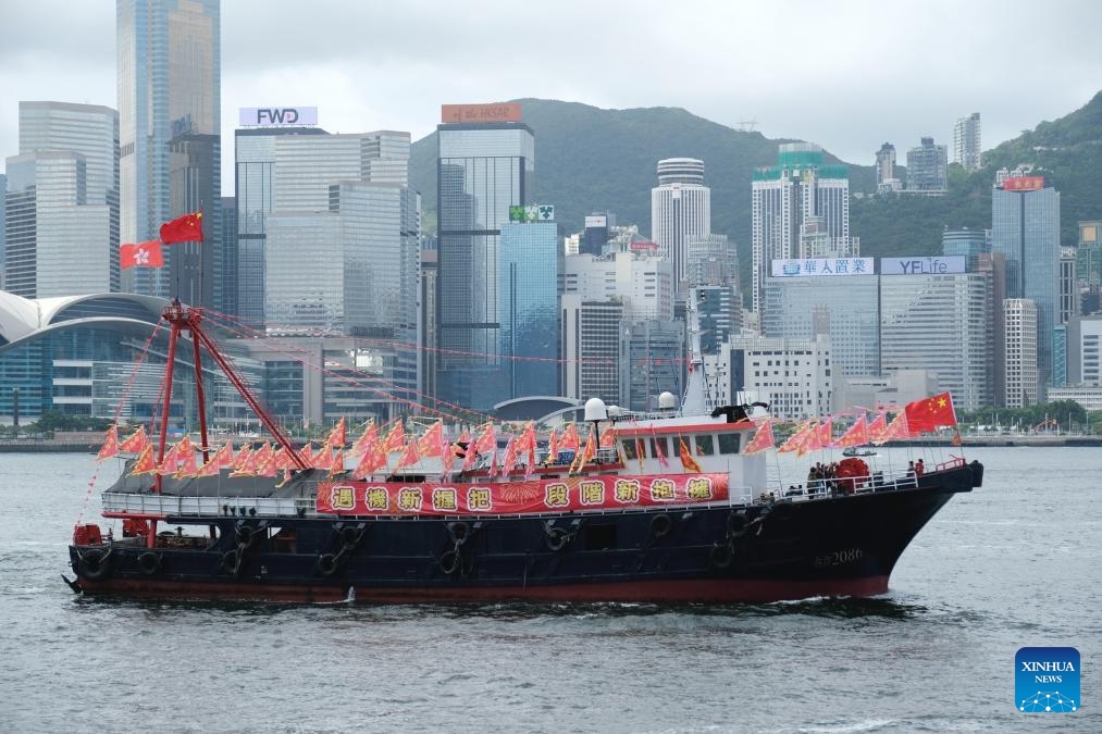 Fishing vessels take part in a cruise held by the Hong Kong Fishermen Consortium to celebrate the 27th anniversary of Hong Kong's return to the motherland at Victoria Harbour in Hong Kong, south China, July 1, 2024. (Photo: Xinhua)