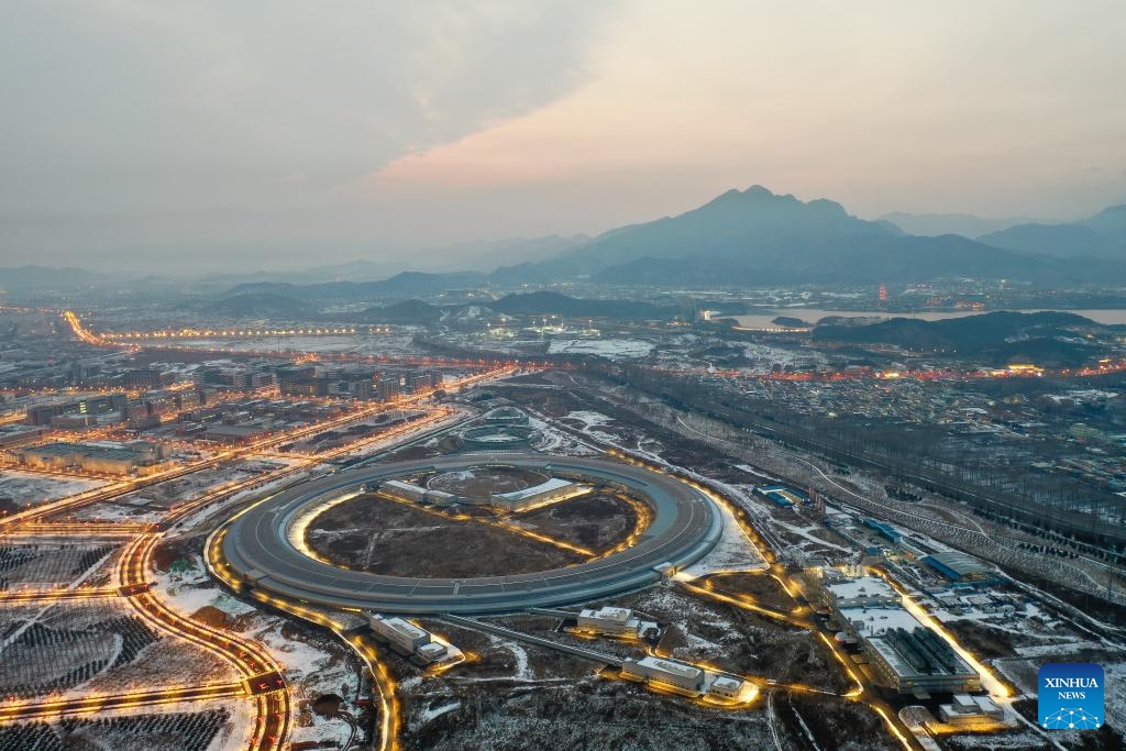 An aerial drone photo taken on Dec. 11, 2023 shows a view of the High Energy Photon Source (HEPS) in Beijing, capital of China. Upon the completion of the vacuum circuit of its storage ring, the HEPS has entered the joint test stage on Monday. The HEPS is a major science infrastructure project built by the Institute of High Energy Physics under the Chinese Academy of Sciences.(Photo: Xinhua)