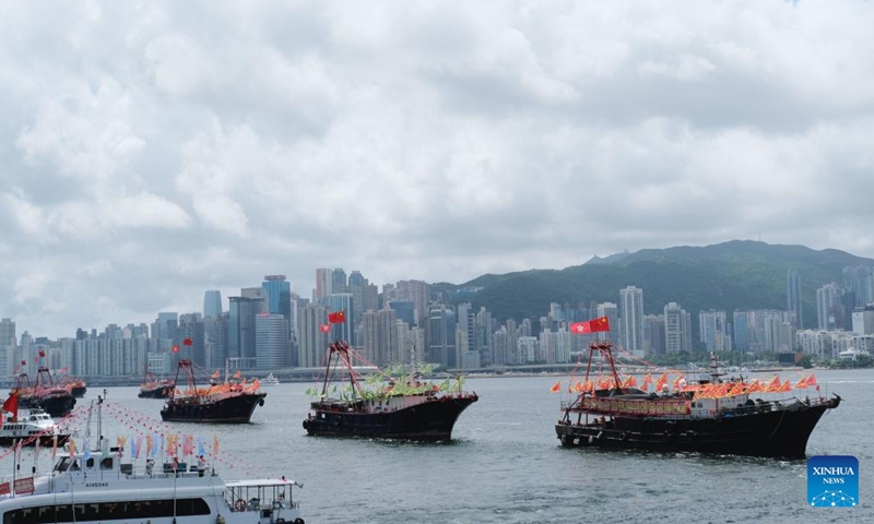 Fishing vessels take part in a cruise held by the Hong Kong Fishermen Consortium to celebrate the 27th anniversary of Hong Kong's return to the motherland at Victoria Harbour in Hong Kong, south China, July 1, 2024.(Photo: Xinhua)