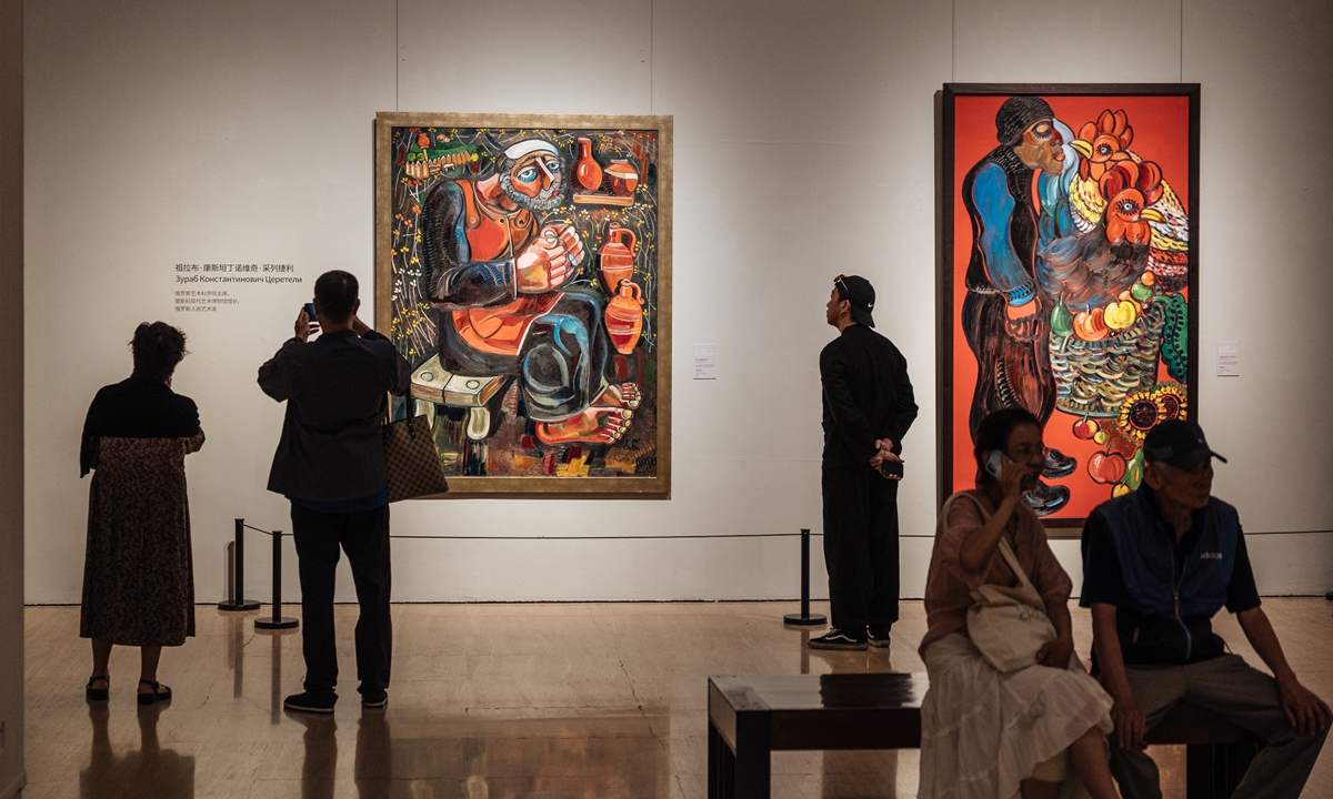 Visitors look at artworks created by academicians of the Russian Academy of Arts at the National Art Museum of China in Beijing on July 2, 2024. The exhibition, which will run until July 8, features over 60 works by more than 20 Russian academicians. Photo: Li Hao/GT