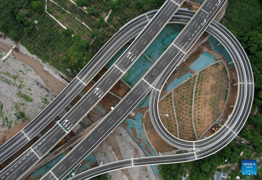 An aerial drone photo taken on July 1, 2024 shows the Beijing section of the Beijing-Yuxian Expressway in Beijing, capital of China. The Beijing section of the Beijing-Yuxian Expressway officially opened to traffic on Monday, reducing road travel time from the Junzhuang interchange on Beijing's west sixth ring road to Lingshan Mountain from 2 hours to 45 minutes. The expressway section will help lower traffic pressure in both the northwest and the southwest of Beijing.(Photo: Xinhua)