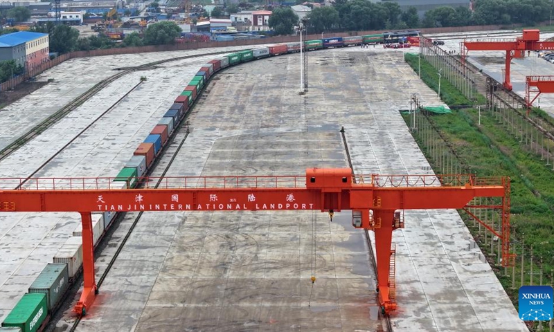 An aerial drone photo taken on July 1, 2024 shows a China-Europe freight train bound for Moscow at Tianjin International Land Port in north China's Tianjin, July 1, 2024. A freight train bound for Moscow, Russia departed from Tianjin International Land Port on Monday, marking the launch of the land port's first China-Europe freight train route. (Photo: Xinhua)