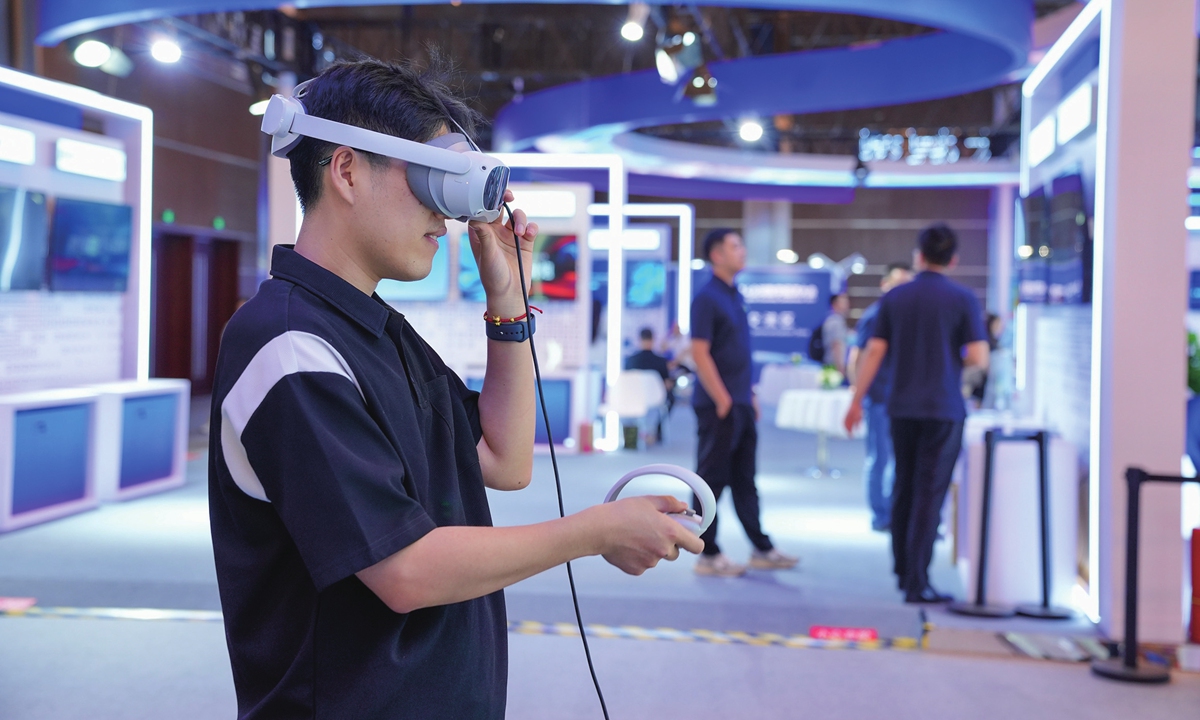 A visitor experiences a new product at the Global Digital Economy Conference 2024 held in Beijing on July 3, 2024. The conference runs from July 2 to July 5, featuring the latest digital technologies and products. Beijing, as its host city, is a national hub for innovation and international exchanges, with its digital economy reaching 1.8 trillion yuan in 2023, up 8.5 percent from the previous year.
Photo: VCG