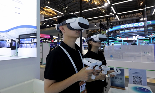 Visitors try VR (virtual reality) headsets at the exhibition area for the Chinese AI and robotics platform company QuantumPharm Inc at WAIC 2024 in Shanghai on July 4, 2024. Photo: Chen Xia/GT