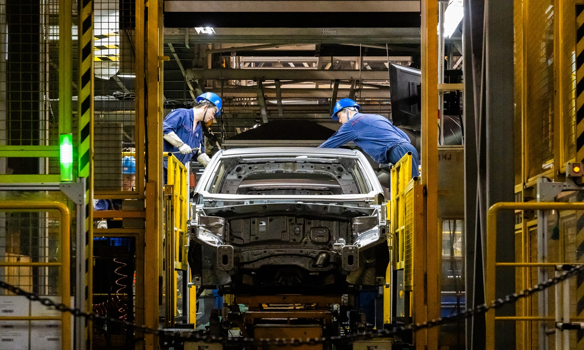 Two workers at a Changan Automobile plant in Southwest China's Chongqing city on May 21, 2024. Photo: Chen Tao/GT