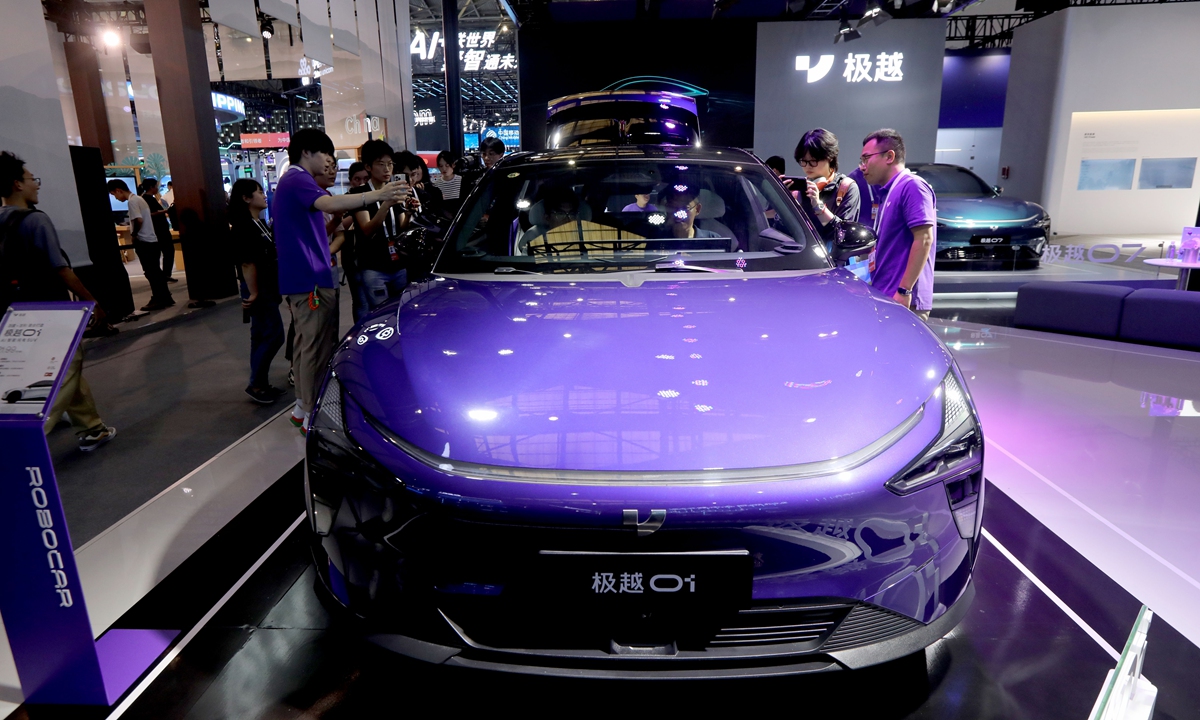 Visitors examine an AI powered electric robocar from Chinese automotive robocar brand JiYue at WAIC 2024 in Shanghai on July 4, 2024. Photo: Chen Xia/GT