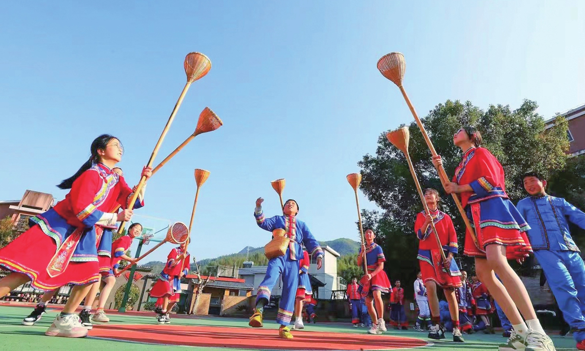 She children play games at a local school in Zhejiang.