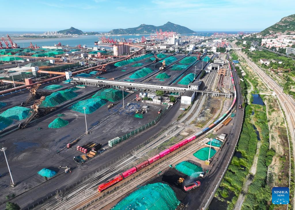 An aerial drone photo taken on June 26, 2024 shows an international freight train pulling out of the China-Kazakhstan (Lianyungang) Logistics Cooperation Base in Lianyungang, east China's Jiangsu Province. Launched in May 2014, the China-Kazakhstan (Lianyungang) Logistics Cooperation Base is the first entity project inaugurated under the Belt and Road Initiative. It acts as the only departure port for Kazakhstan's grain transit in China and an important dry port for landlocked Central Asian countries. (Photo: Xinhua)