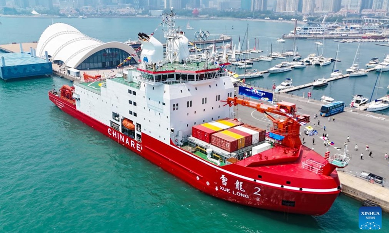 An aerial drone photo taken on July 3, 2024 shows China's icebreaker Xuelong 2 berthing at the pier of Qingdao Olympic Sailing Center in Qingdao, east China's Shandong Province. China's icebreaker Xuelong 2 and icebreaker research vessel Jidi were open to public here on Wednesday. This is also the first time for Jidi, China's independently designed and built icebreaker research vessel, to allow for public visit since its official delivery on June 24 this year. (Photo: Xinhua)