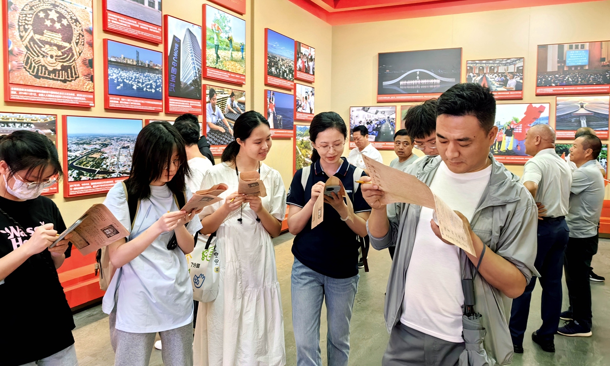 Young people explore the Memorial of the First National Congress of the Communist Party of China in Shanghai on July 1, 2024. Photo: VCG