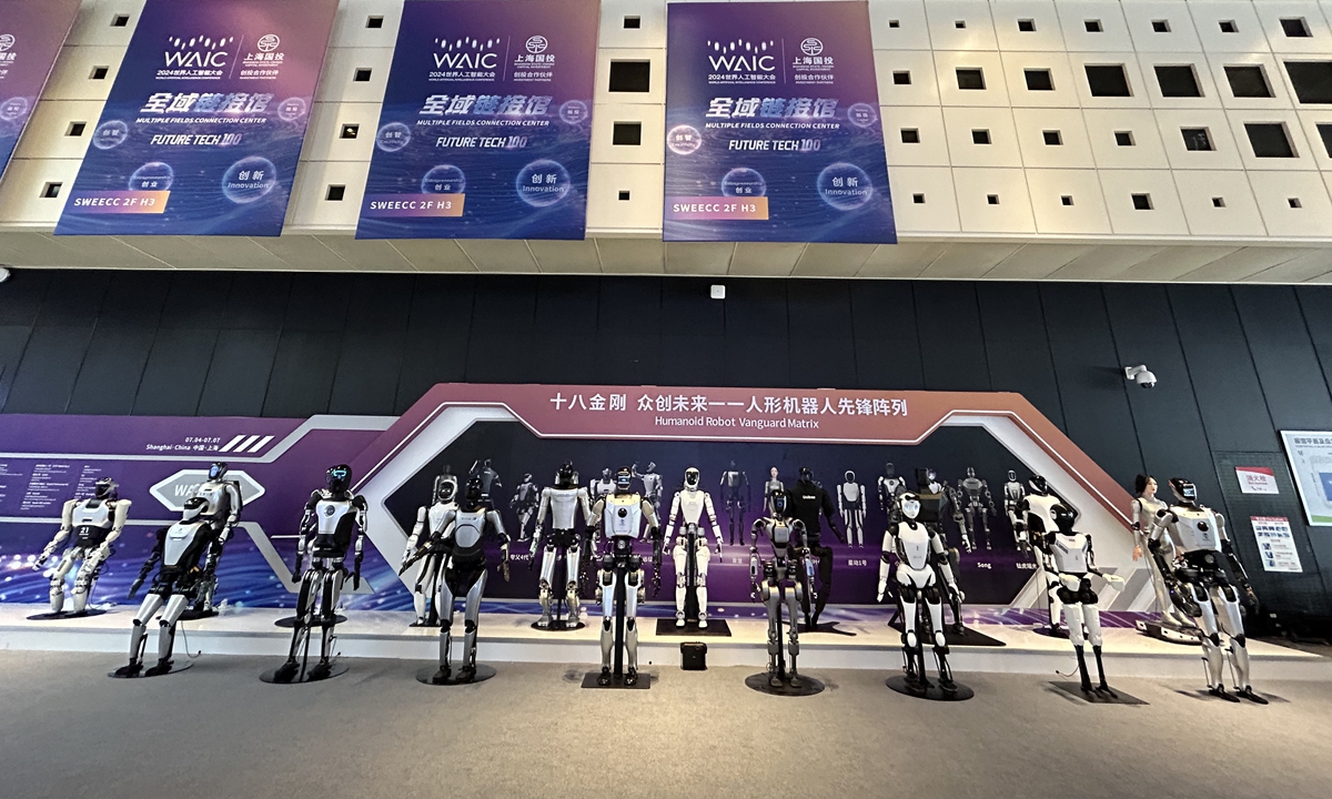 A lineup of 18 humanoid robots formed a vanguard matrix at WAIC Shanghai on Thursday. Photo: Qi Xijia/ GT