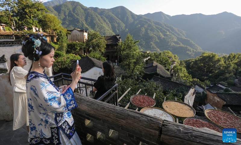 Tourists visit Huangling Village of Wuyuan County, east China's Jiangxi Province, July 3, 2024. In recent years, Wuyuan County has been making efforts to promote rural tourism by exploring and utilizing its unique natural resources and traditional culture. Photo: Xinhua