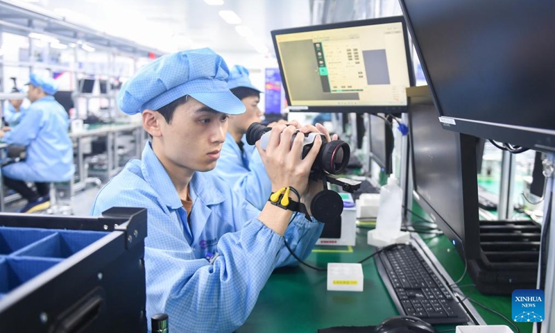 Staff members work on a production line of infrared thermal imagers at Guide Infrared Group in Wuhan, central China's Hubei Province, Feb. 28, 2024. Wuhan East Lake High-tech Development Zone, also known as the optics valley of China, is the birthplace of China's first optical fiber and a national optoelectronic information industry base. In recent years, Hubei Province has made major breakthroughs in the development of optoelectronic information industry and accelerated the building of optoelectronic information industry clusters. Photo: Xinhua