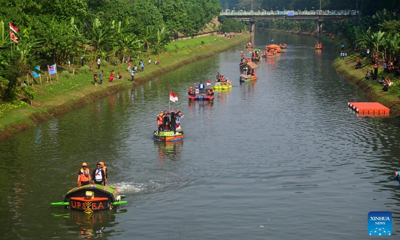 Boats made of plastic bottles sail in the Banjir Kanal Timur river in Jakarta, Indonesia, July 27, 2024. Thirty-two boats made of waste plastics and in various shapes took part in a boat parade event in the Banjir Kanal Timur river in Jakarta, Indonesia on July 27. Organized by local water agencies on Indonesia's National Rivers Day, the event is to call on people to protect rivers and recycle plastic waste. Photo: Xinhua