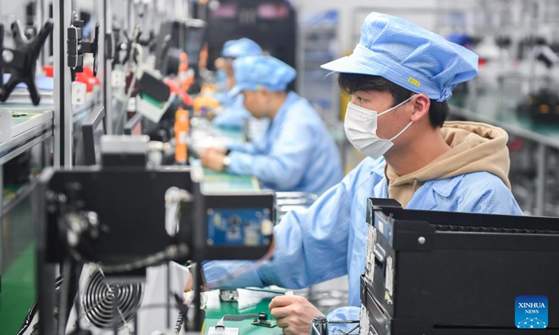 Staff members work on a production line of infrared thermal imagers at Guide Infrared Group in Wuhan, central China's Hubei Province, Feb. 28, 2024. Wuhan East Lake High-tech Development Zone, also known as the optics valley of China, is the birthplace of China's first optical fiber and a national optoelectronic information industry base. In recent years, Hubei Province has made major breakthroughs in the development of optoelectronic information industry and accelerated the building of optoelectronic information industry clusters. Photo: Xinhua