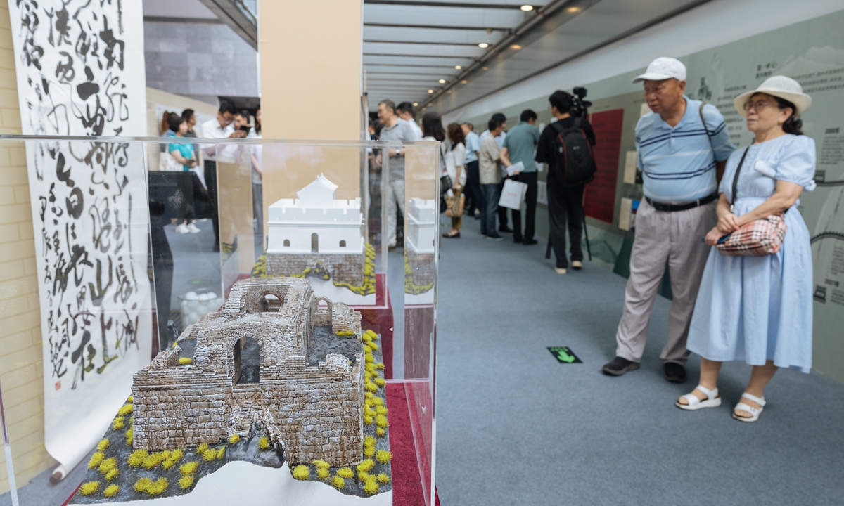 Visitors explore an exhibition highlighting the contributions of social organizations and individuals in protecting the Great Wall at the Capital Museum in Beijing on July 5, 2024. Photo: Li Hao/GT