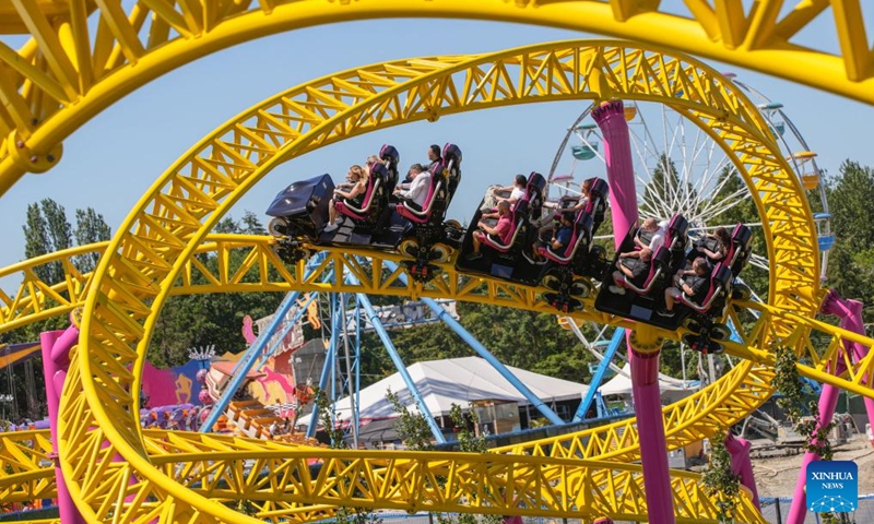 People ride on the new roller coaster during the launching event at Pacific National Exhibition (PNE) Playland in Vancouver, British Columbia, Canada, on July 5, 2024. The new ride, called ThunderVolt, launched on Friday at Vancouver's PNE Playland. Photo: Xinhua