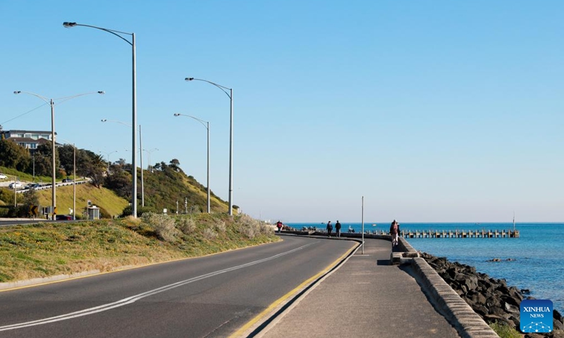 People take a walk along the road by the sea in Frankston, a suburb in Melbourne, Australia, July 3, 2024. Photo: Xinhua