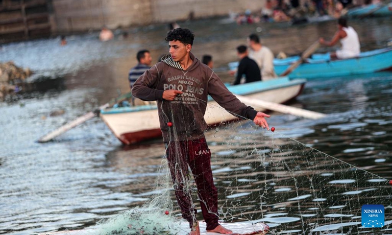 Fishermen fish at a waterfall in the Nile River in Qalyubia Governorate, Egypt, on July 6, 2024. Hundreds of amateur and professional fishermen gathered here to fish and escape the heat during hot summer. Photo: Xinhua