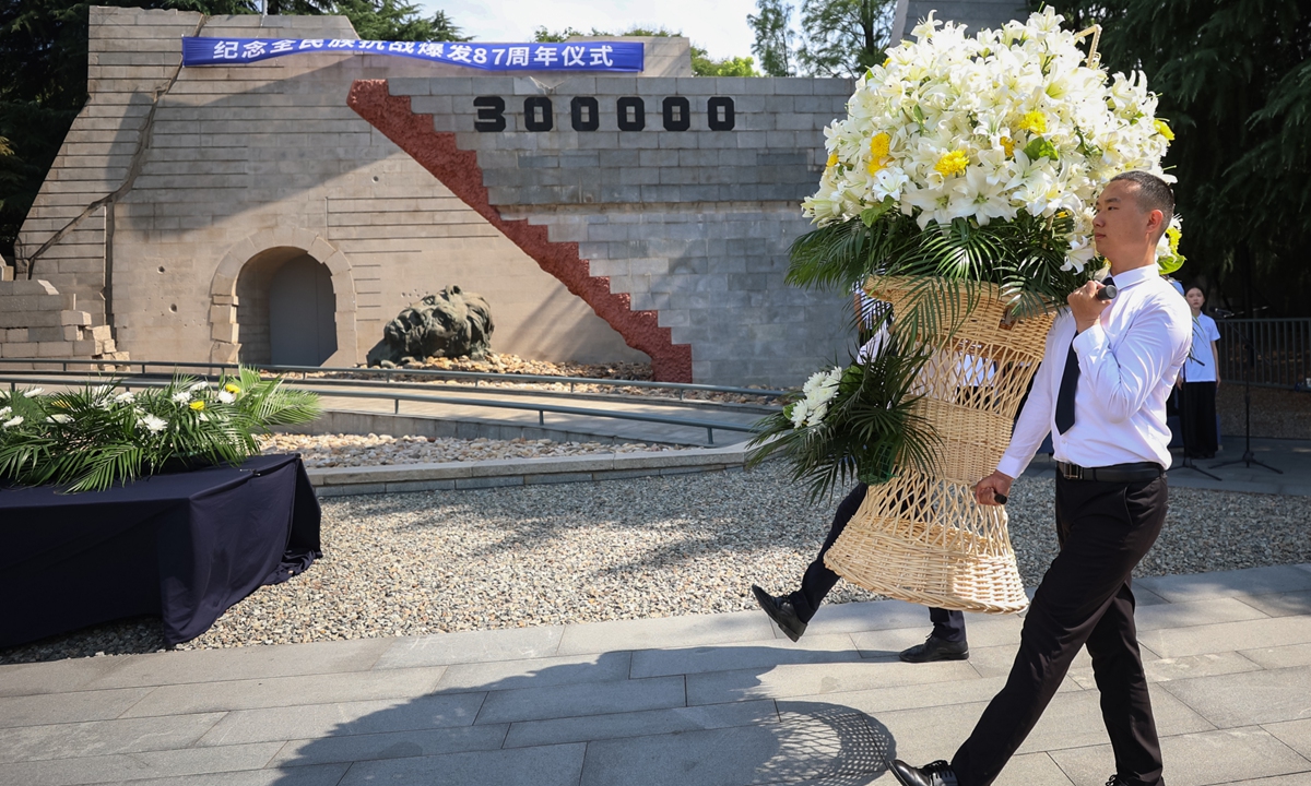 A flower basket is dedicated to commemorate the victims and martyrs in the War of Resistance against Japanese Aggression in Nanjing, East China's Jiangsu Province on July 7, 2024, which marks the 87th anniversary of the whole-nation resistance. The 