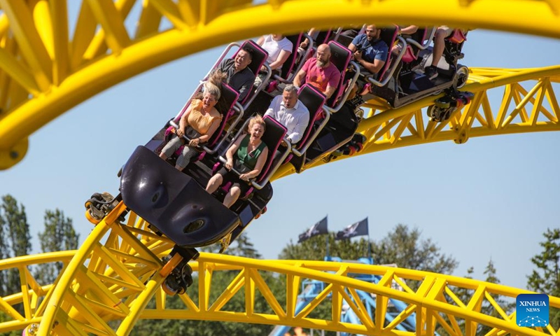 People ride on the new roller coaster during the launching event at Pacific National Exhibition (PNE) Playland in Vancouver, British Columbia, Canada, on July 5, 2024. The new ride, called ThunderVolt, launched on Friday at Vancouver's PNE Playland. Photo: Xinhua