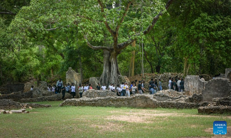 This photo taken on April 15, 2023 shows people visiting the ruins of Gedi in Kilifi County, Kenya. The historic town of Gedi in the coastal region of Kenya has been inscribed on the World Heritage List by the United Nations Educational, Scientific and Cultural Organization (UNESCO), the National Museums of Kenya (NMK) said on Saturday. (Xinhua/Han Xu)