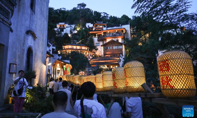 Tourists visit Huangling Village of Wuyuan County, east China's Jiangxi Province, July 3, 2024. In recent years, Wuyuan County has been making efforts to promote rural tourism by exploring and utilizing its unique natural resources and traditional culture. Photo: Xinhua