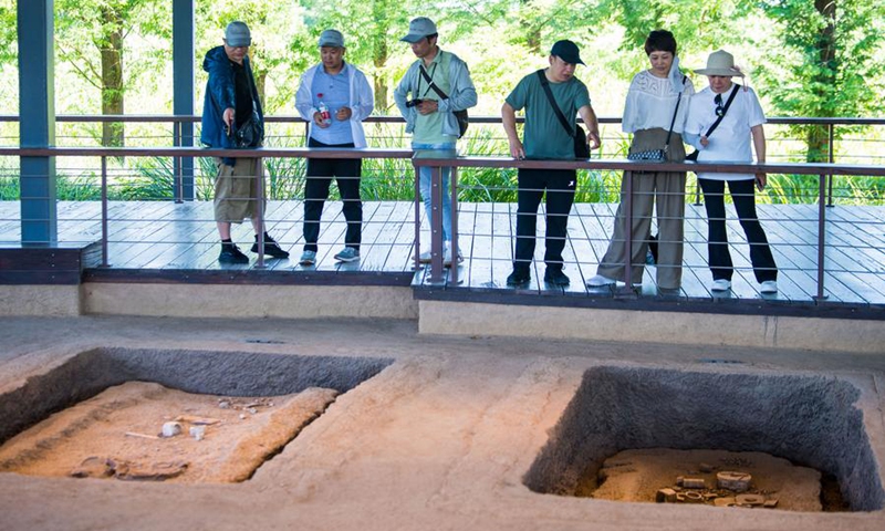 People visit the Fanshan Cemetery Site at the Archaeological Ruins of Liangzhu City park in Hangzhou, capital city of east China's Zhejiang Province, July 4, 2024. Photo: Xinhua