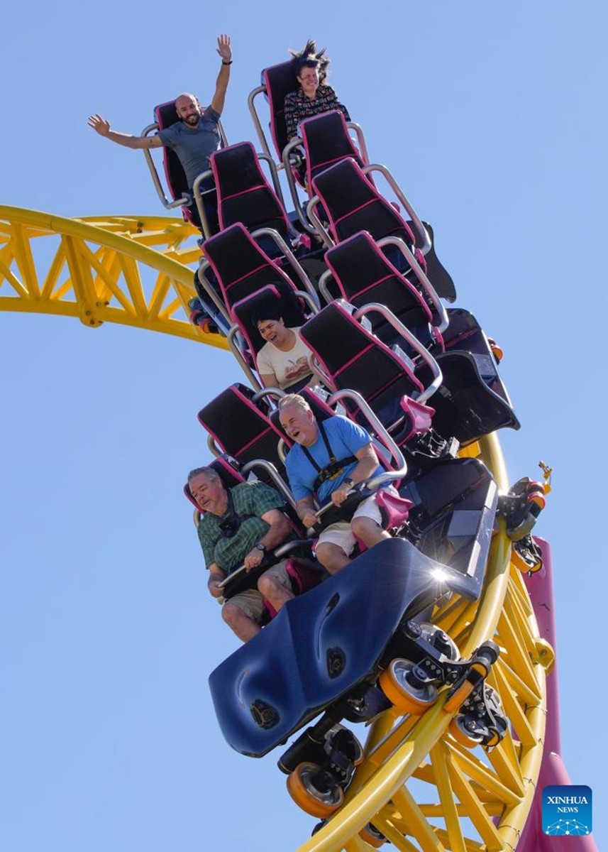 People ride on the new roller coaster during the launching event at Pacific National Exhibition (PNE) Playland in Vancouver, British Columbia, Canada, on July 5, 2024. The new ride, called ThunderVolt, launched on Friday at Vancouver's PNE Playland. Photo: Xinhua