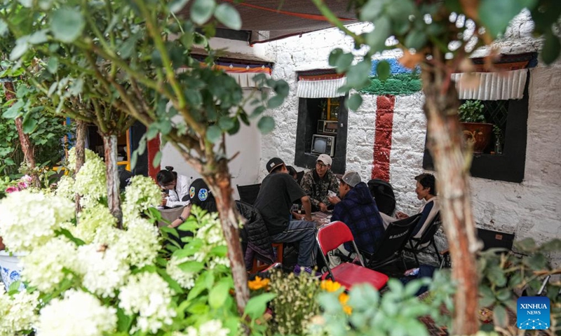 This photo taken on July 5, 2024 shows a view of a cafe on the Barkhor Street in Lhasa, southwest China's Xizang Autonomous Region. 