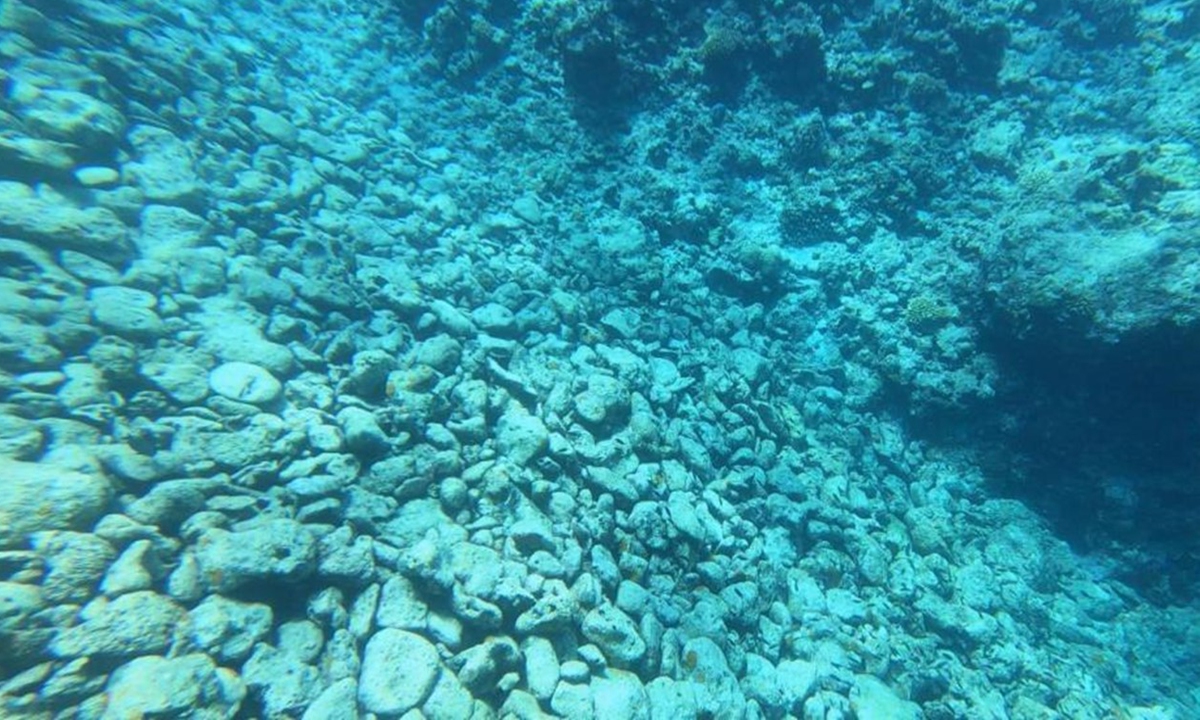 Photo taken by scientists who dived in the water near Ren'ai Jiao shows large amounts of coral fragments in the groove. Photo: Courtesy of South China Sea Ecological Center of China's Ministry of Natural Resources 