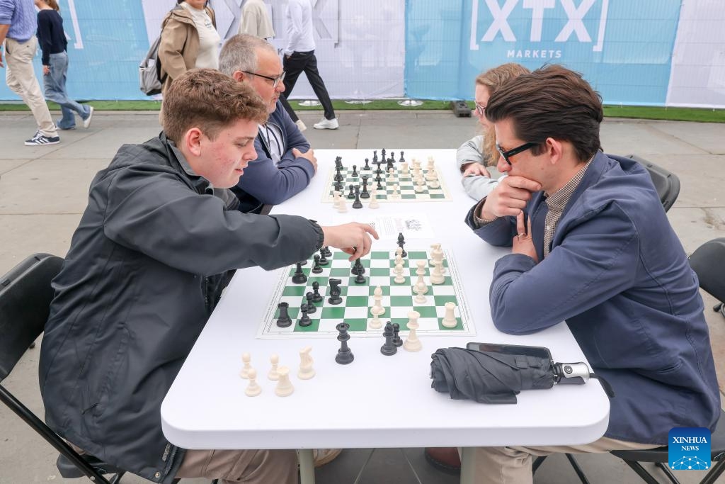 People play chess during the ChessFest at the Trafalgar Square in London, Britain, July 7, 2024. ChessFest, an annual open-air chess festival in Britain, took place in London on Sunday. (Photo: Xinhua)