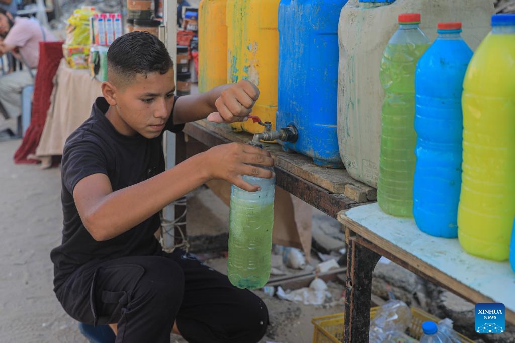 A Palestinian bottles locally produced soap in the southern Gaza Strip city of Khan Younis, on July 9, 2024. Palestinians suffer from the lack of soap and body cleansers in the markets. (Photo: Xinhua)