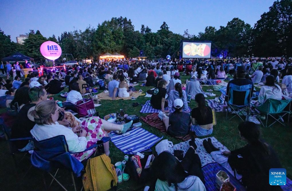 People watch a movie at an open-air cinema at Stanley Park in Vancouver, British Columbia, Canada, July 9, 2024. (Photo: Xinhua)