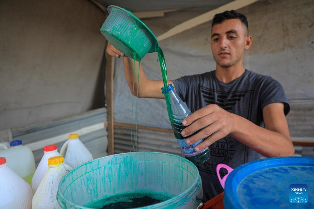 A Palestinian bottles locally produced soap in the southern Gaza Strip city of Khan Younis, on July 9, 2024. Palestinians suffer from the lack of soap and body cleansers in the markets. (Photo: Xinhua)